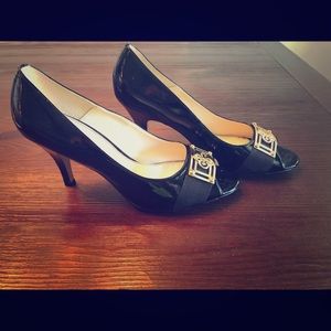 Black patent Isola open toe pumps